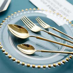 Image of 30-piece shiny gold stainless steel flatware set for stylish dining