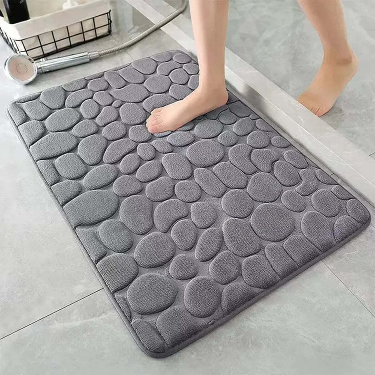 Image of 3D non-slip absorbent stone bath mat with cobblestone embossed design