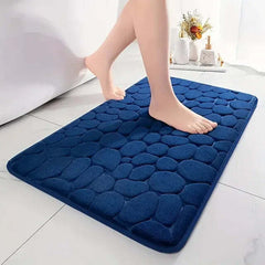 Image of 3D non-slip absorbent stone bath mat with cobblestone embossed design