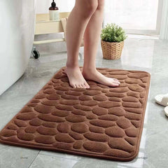 Image of 3D non-slip absorbent stone bath mat with cobblestone embossed design