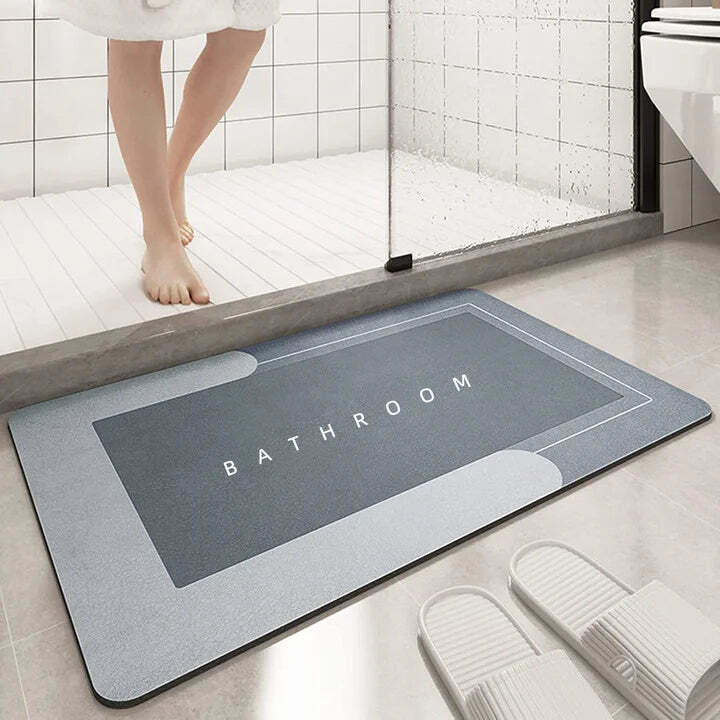 Image of Absorbent diatomite bath mat with non-slip design for comfort and safety