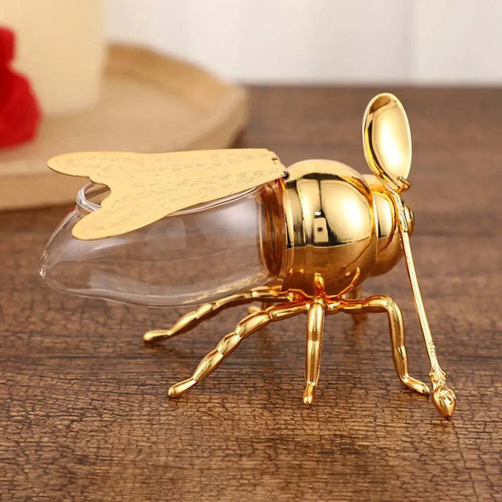 Image of Bee-shaped honey jar with spoon for kitchen decor and unique gift for tea lovers