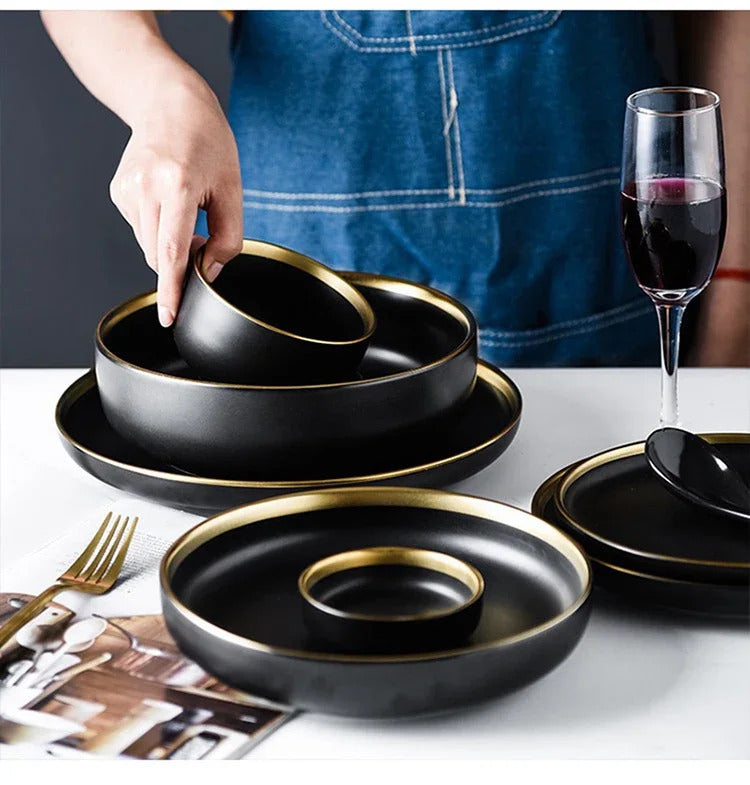 Image of Black porcelain dinnerware set with gold rim for home and restaurant