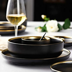 Image of Black porcelain dinnerware set with gold rim for home and restaurant