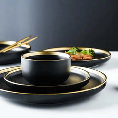 Image of Black porcelain dinnerware set with gold rim for home and restaurant