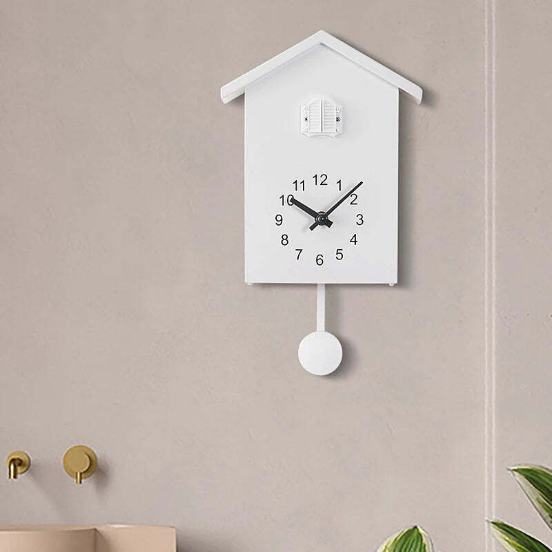 Image of Cuckoo quartz wall clock with modern bird design for home and office decor