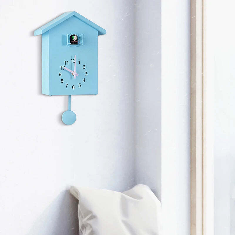 Image of Cuckoo quartz wall clock with modern bird design for home and office decor