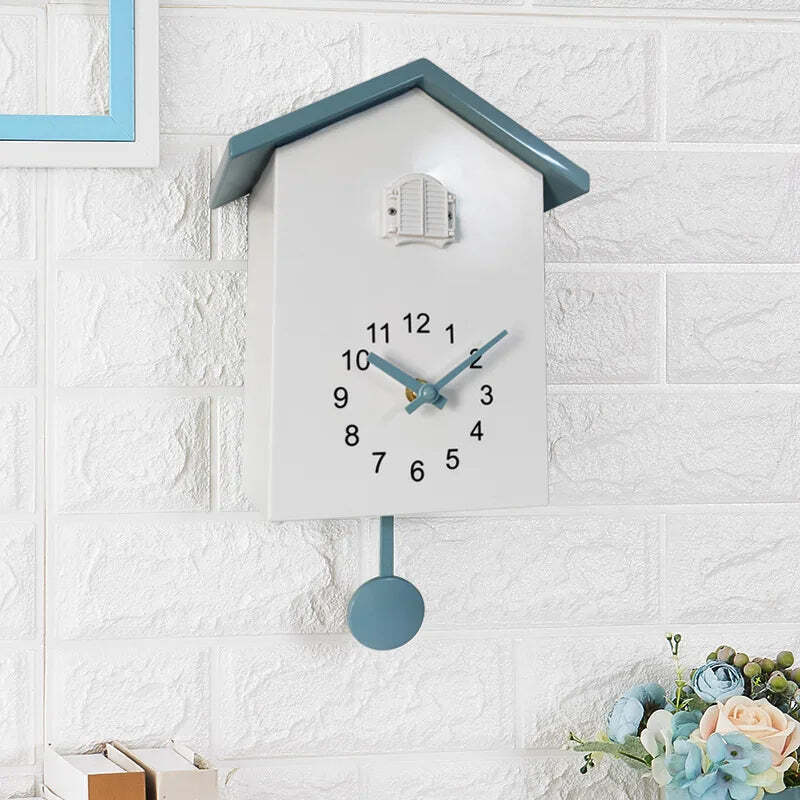 Image of Cuckoo quartz wall clock with modern bird design for home and office decor