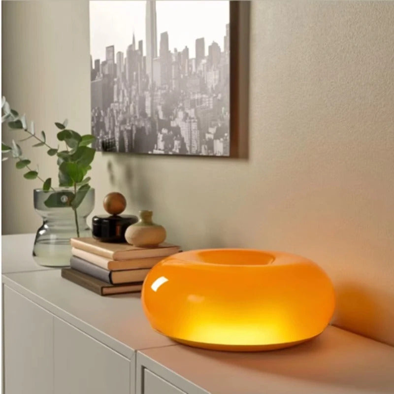 Image of Donut glass wall lamps in orange and white light for stylish indoor ambient lighting