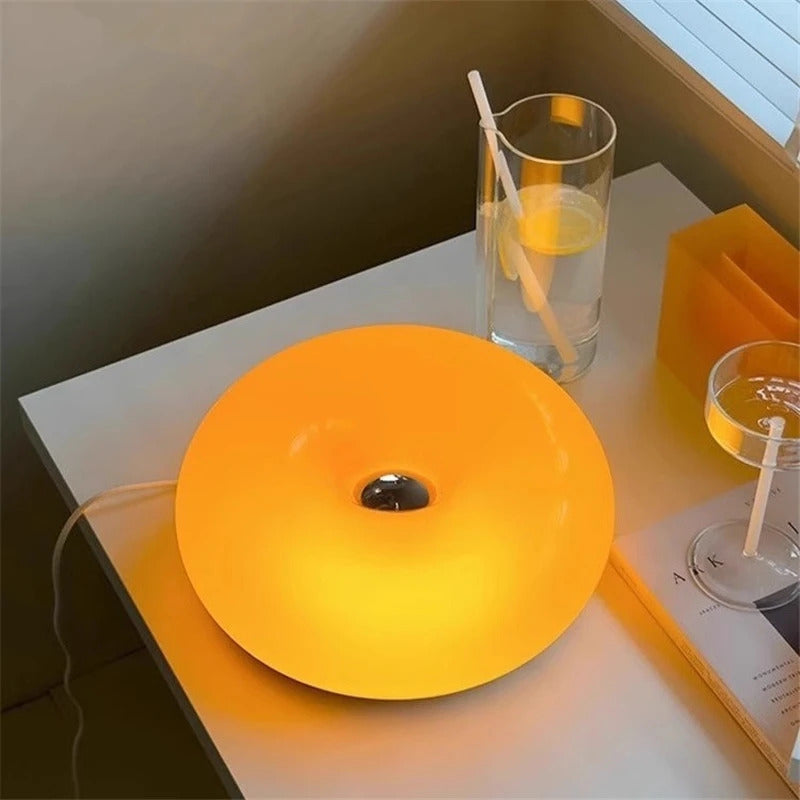 Image of Donut glass wall lamps in orange and white light for stylish indoor ambient lighting