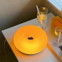 Image of Donut glass wall lamps in orange and white light for stylish indoor ambient lighting