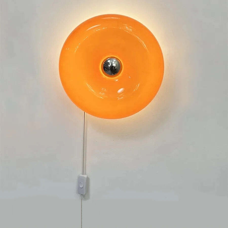 Image of Donut glass wall lamps in orange and white light for stylish indoor ambient lighting