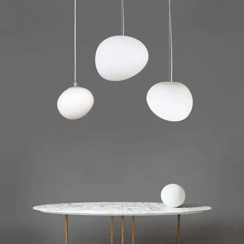 Image of Foscarini Gregg pendant light with round globe glass for modern living rooms