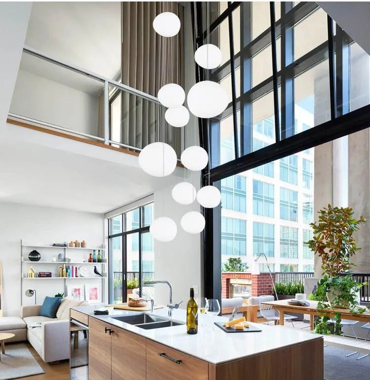 Image of Foscarini Gregg pendant light with round globe glass for modern living rooms