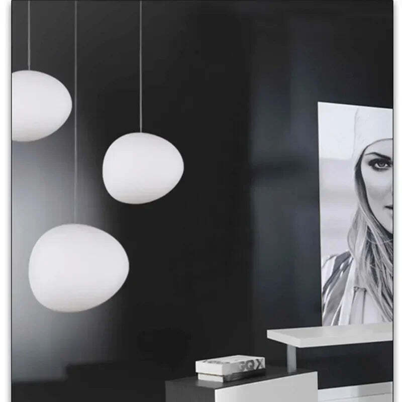 Image of Foscarini Gregg pendant light with round globe glass for modern living rooms