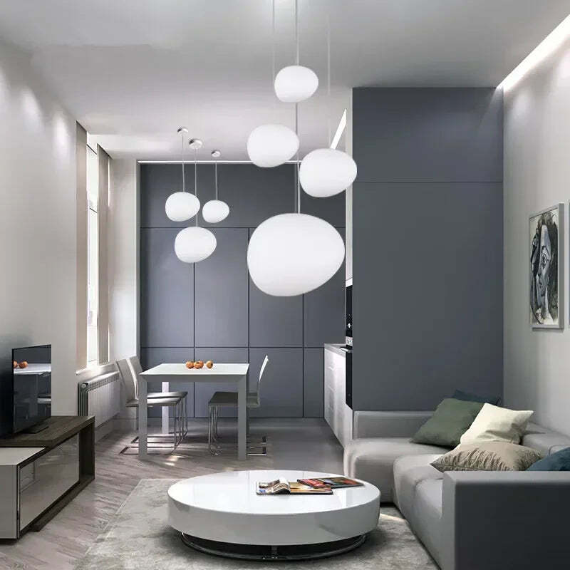 Image of Foscarini Gregg pendant light with round globe glass for modern living rooms