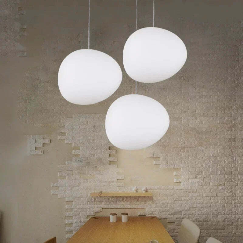 Image of Foscarini Gregg pendant light with round globe glass for modern living rooms