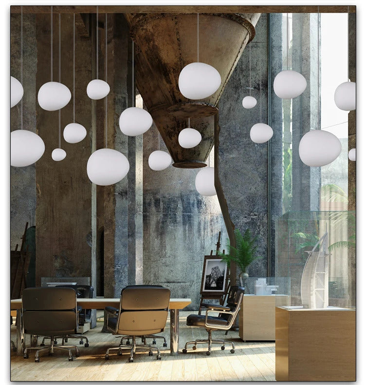 Image of Foscarini Gregg pendant light with round globe glass for modern living rooms