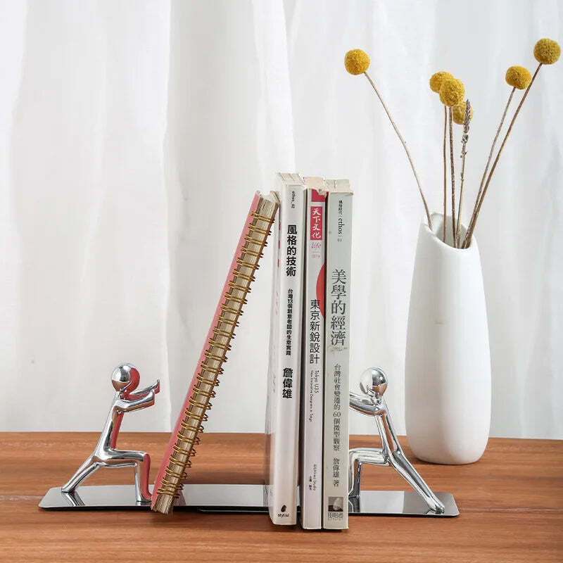 Image of Golden boy bookends: stylish metal book stand holders for home and office organization