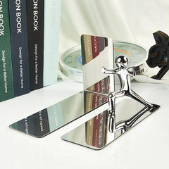 Image of Golden boy bookends: stylish metal book stand holders for home and office organization