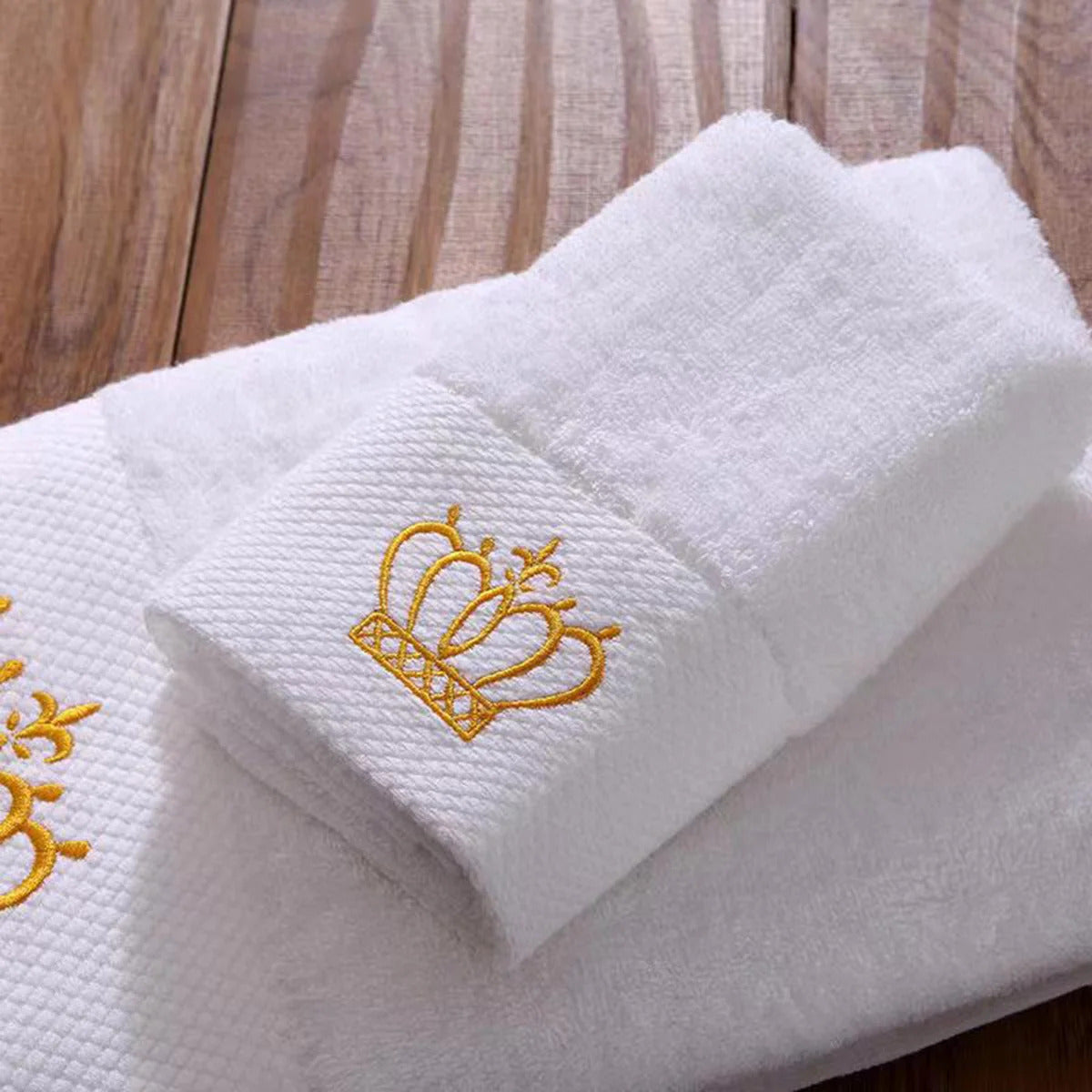 Image of Luxury cotton bath towel set with embroidered crown design