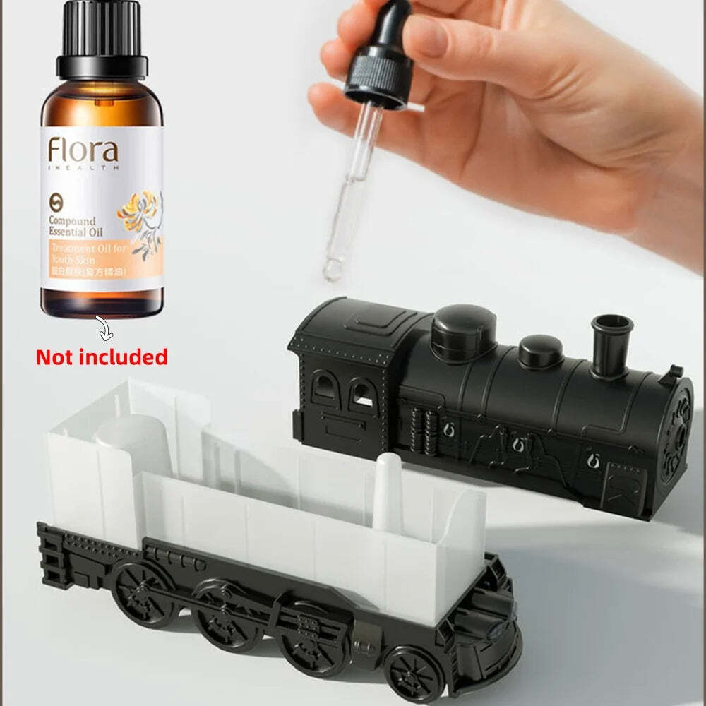 Image of Mini train shape essential oil diffuser with remote control and light functionality