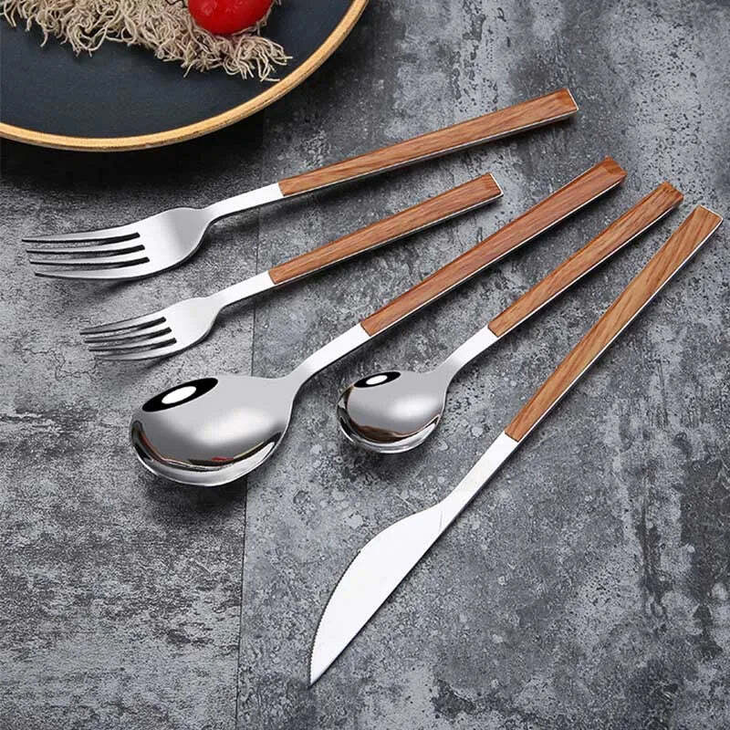 Image of Stainless steel dinnerware set with wooden handle for stylish dining