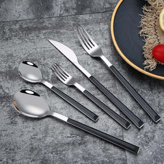 Image of Stainless steel dinnerware set with wooden handle for stylish dining