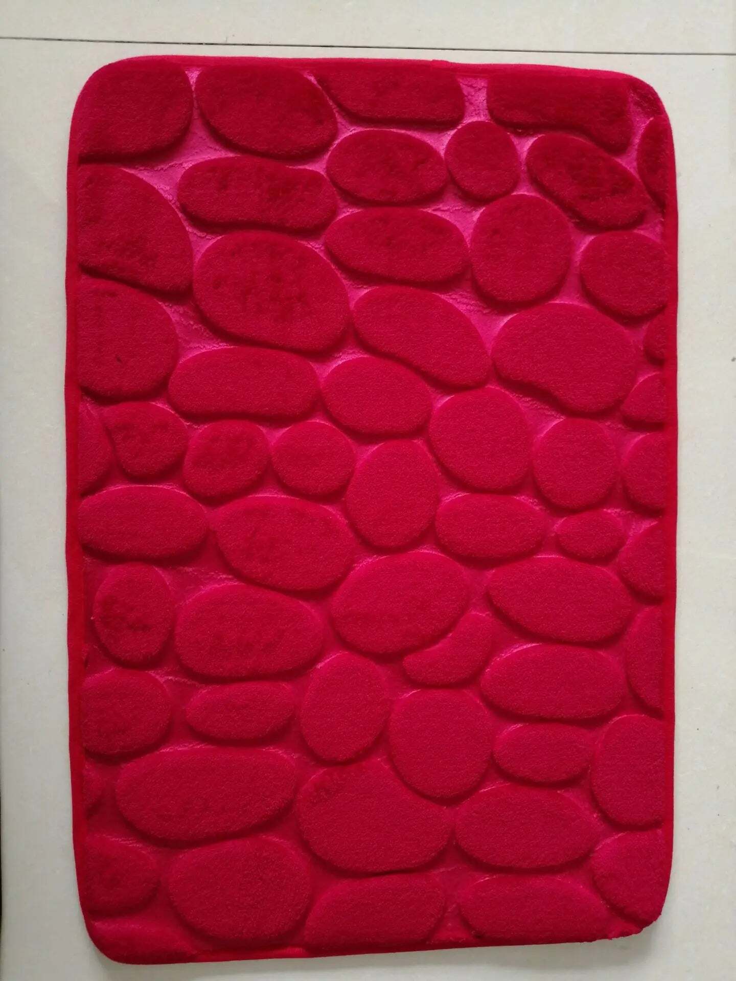 Cobblestone embossed memory foam bath mat with anti-slip backing